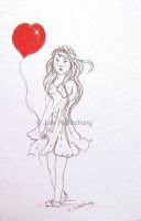 cute freckled girl  with a heart balloon